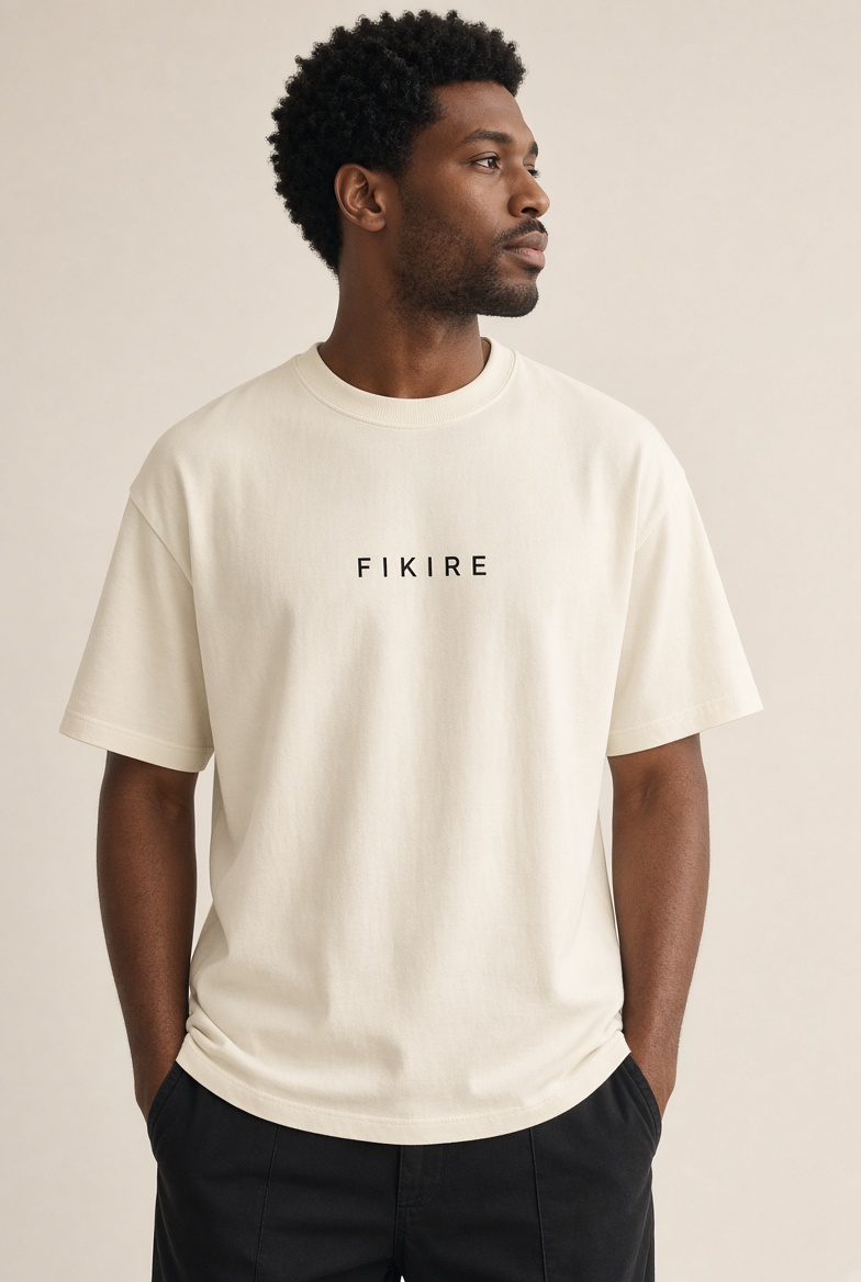 Cream FIKIRE Essential Tee shown on a model